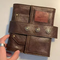 Brown retro leather buckle notebook with loose-leaf binder binding and A7 size format