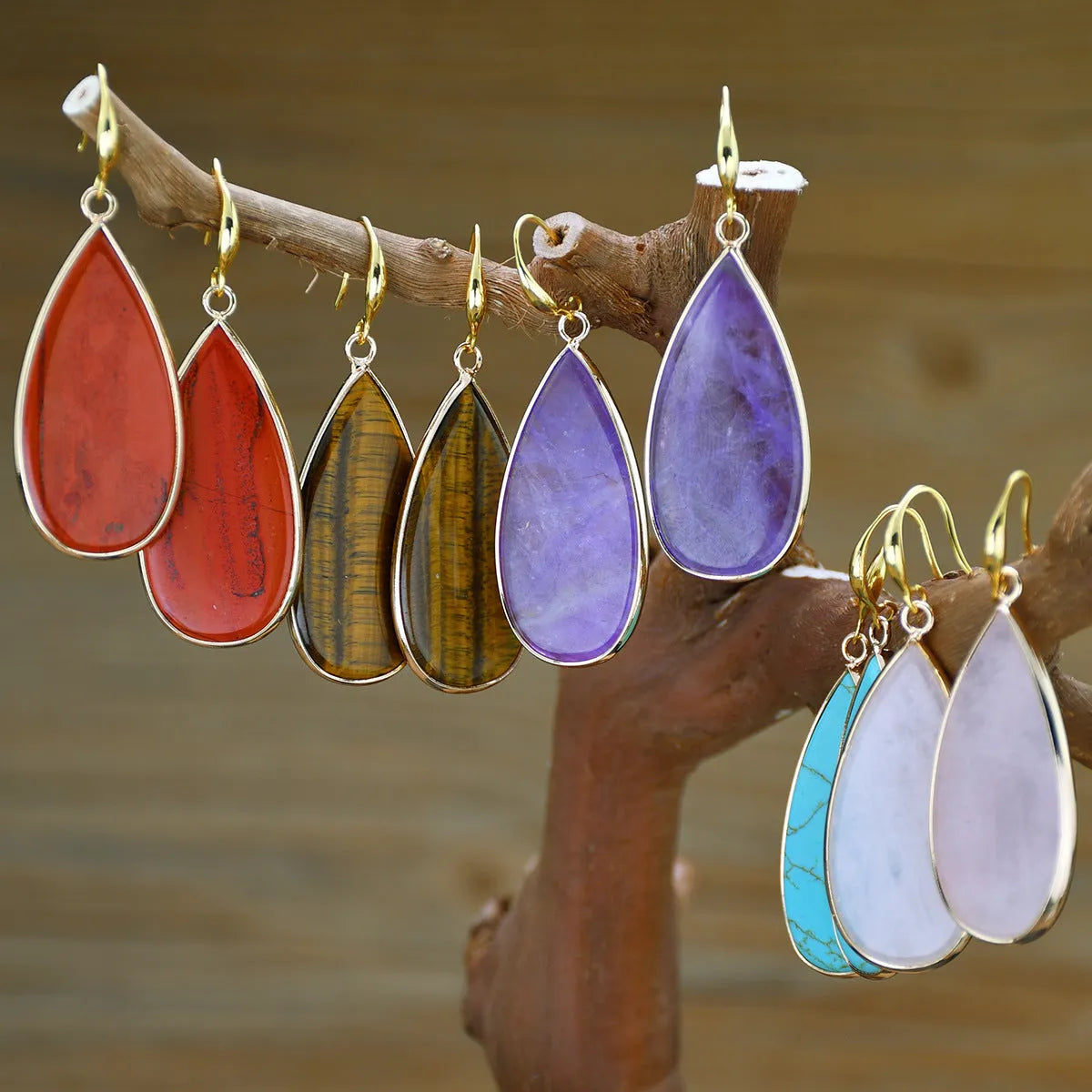 Vintage tigereye stone drop earrings with elongated water drop shape and textured elements