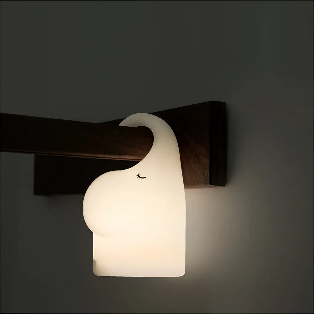 DOMI elephant-shaped silicone night light with dimmer control on bedside table