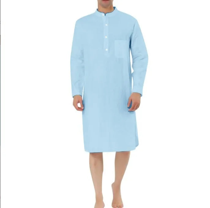 Man wearing a dark blue cotton robe shirt with button front and chest pocket