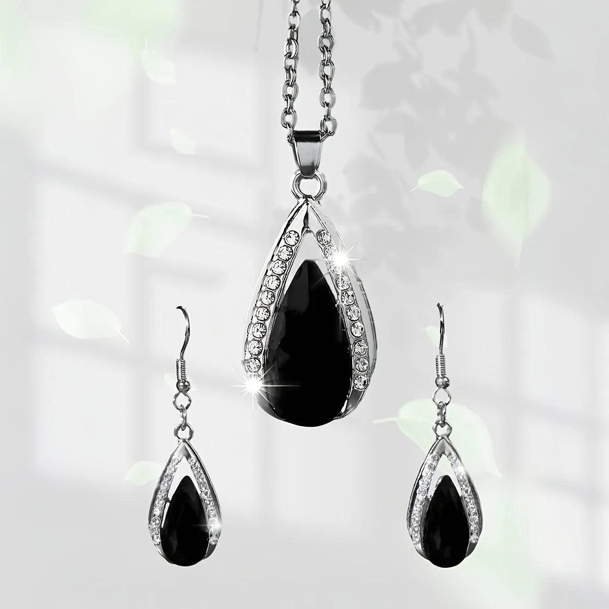 Teardrop glass pendant necklace and earrings matching suite in black or red alloy jewellery