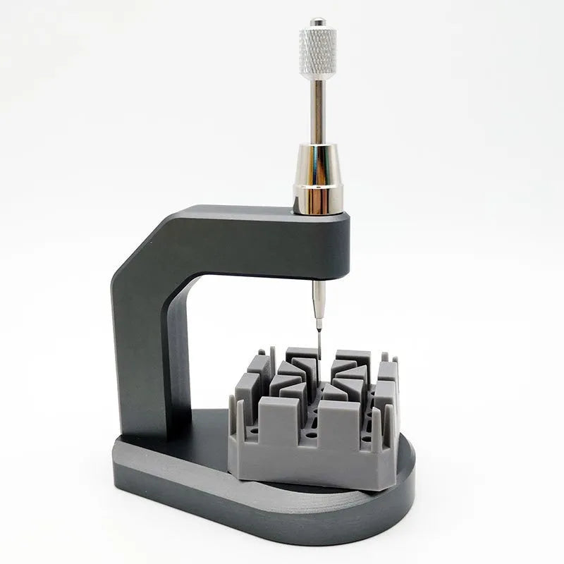 Silver multi-purpose press strap removal tool made from tool steel for watches, jewellery, and electronics.