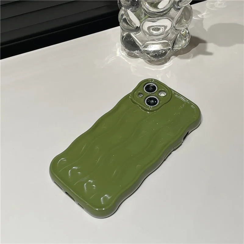 Silicone iPhone 17 case with water ripple texture in wavy green colour showing soft shell construction