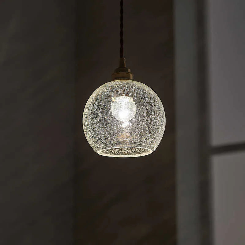 Brass chandelier with glass ball shades measuring 17.5cm wide, showing electroplated copper construction