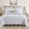 European-style cotton embroidered bedspread and pillowcase set on a 1.8 metre bed.