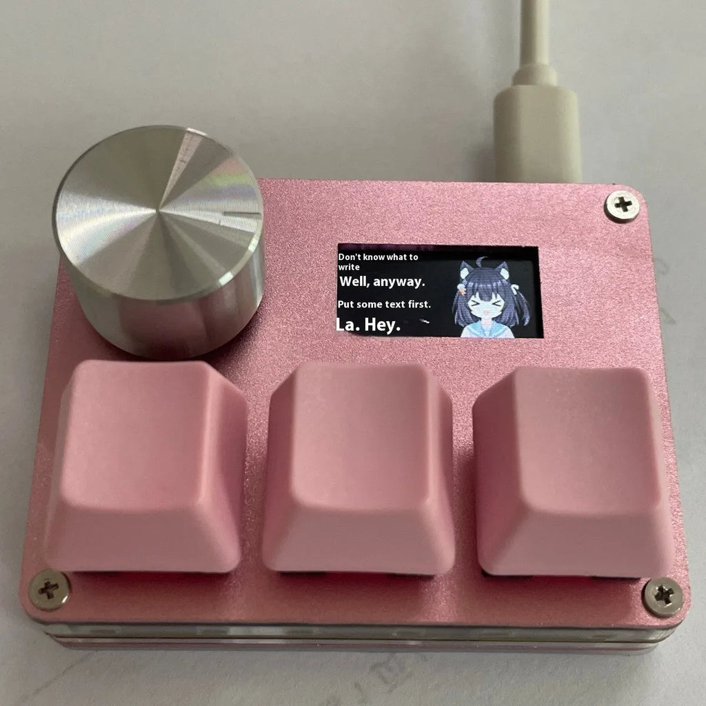 Customisable magnetic axis gaming numeric keypad with colour screen and control knob on desk