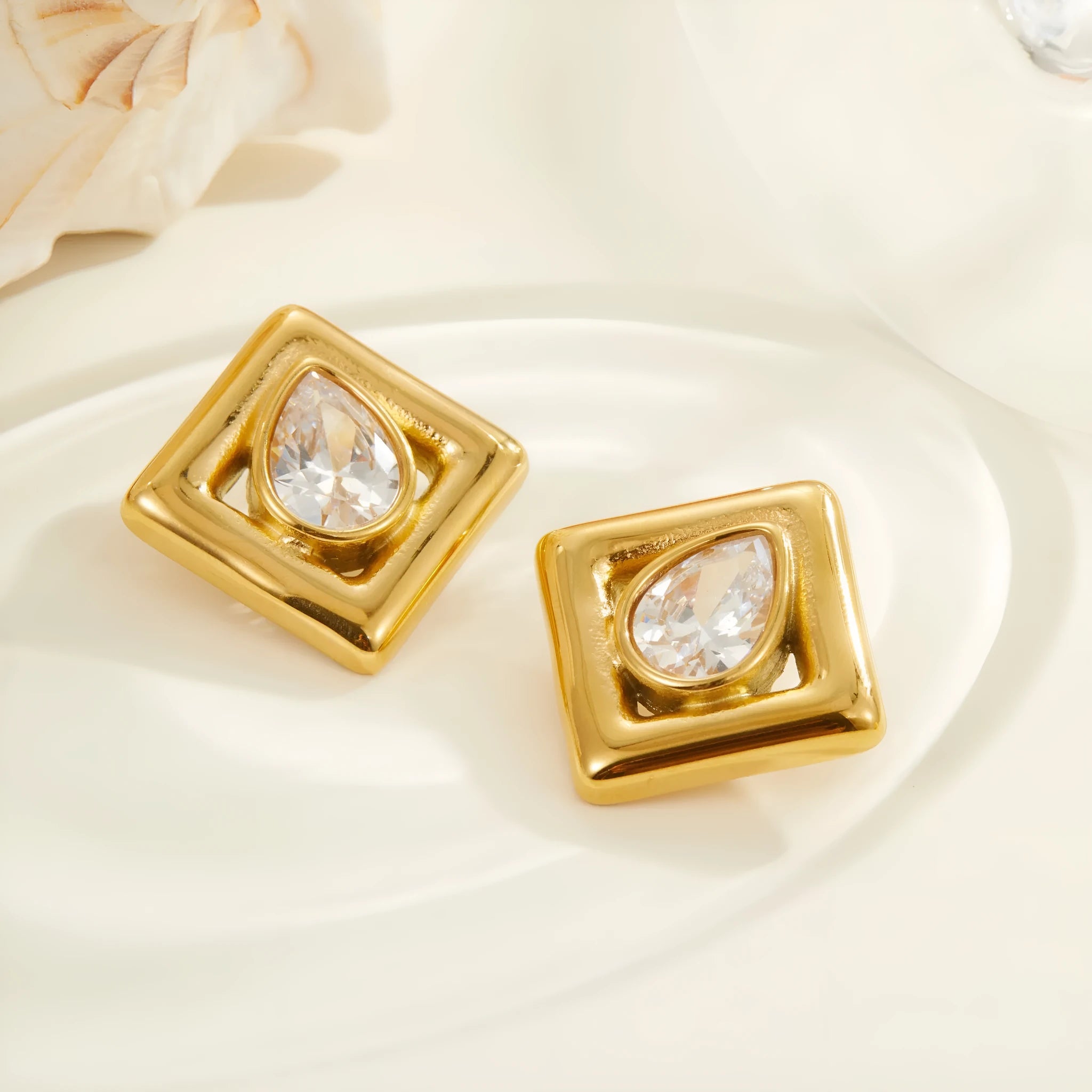Geometric water drop shaped stud earrings with zircon inlay and gold electroplated finish