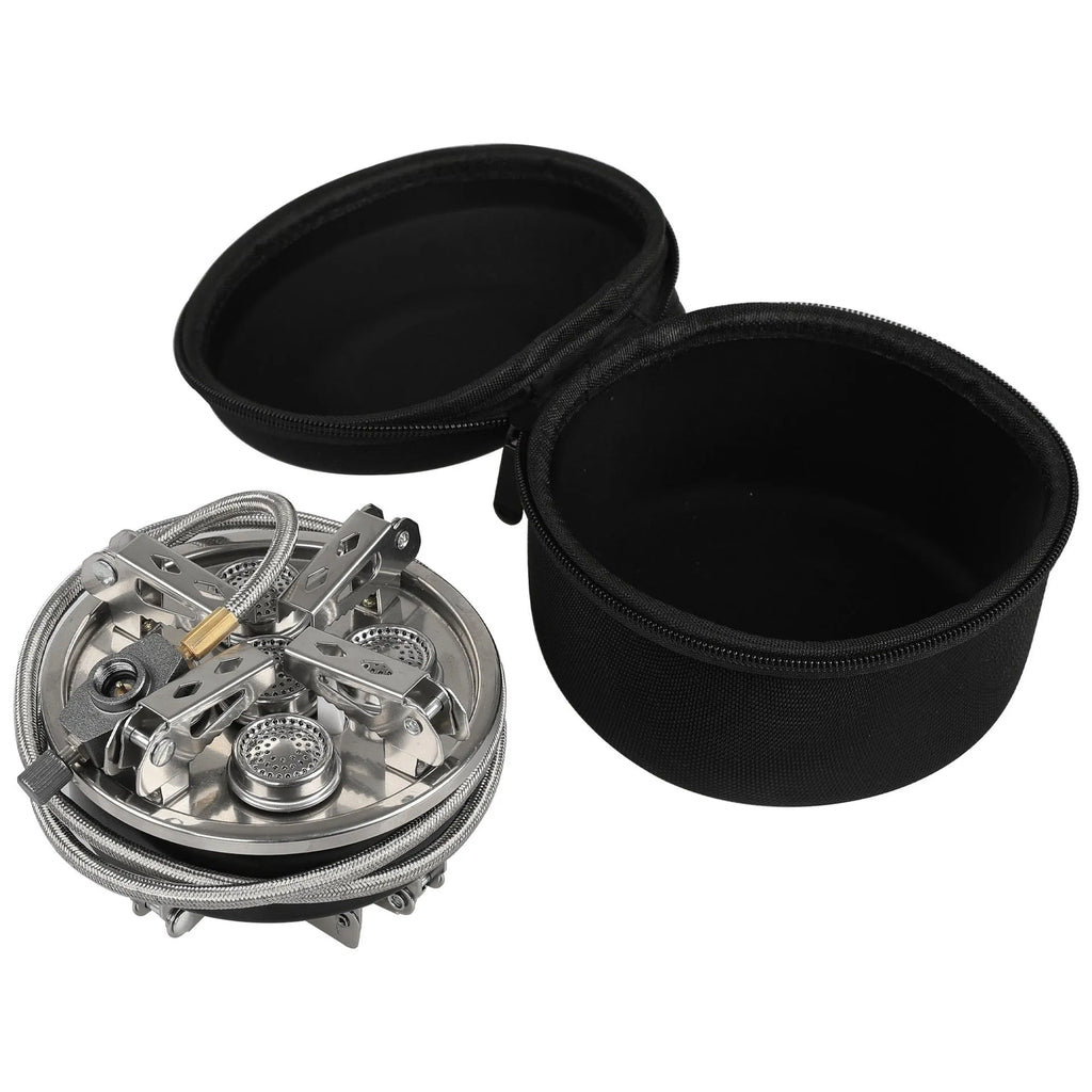 Silver portable folding camping gas stove made of stainless steel and copper with a long black hose.