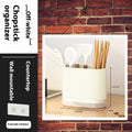 Modern plastic wall-mounted chopsticks and spoon holder in beige, dark green, or orange.