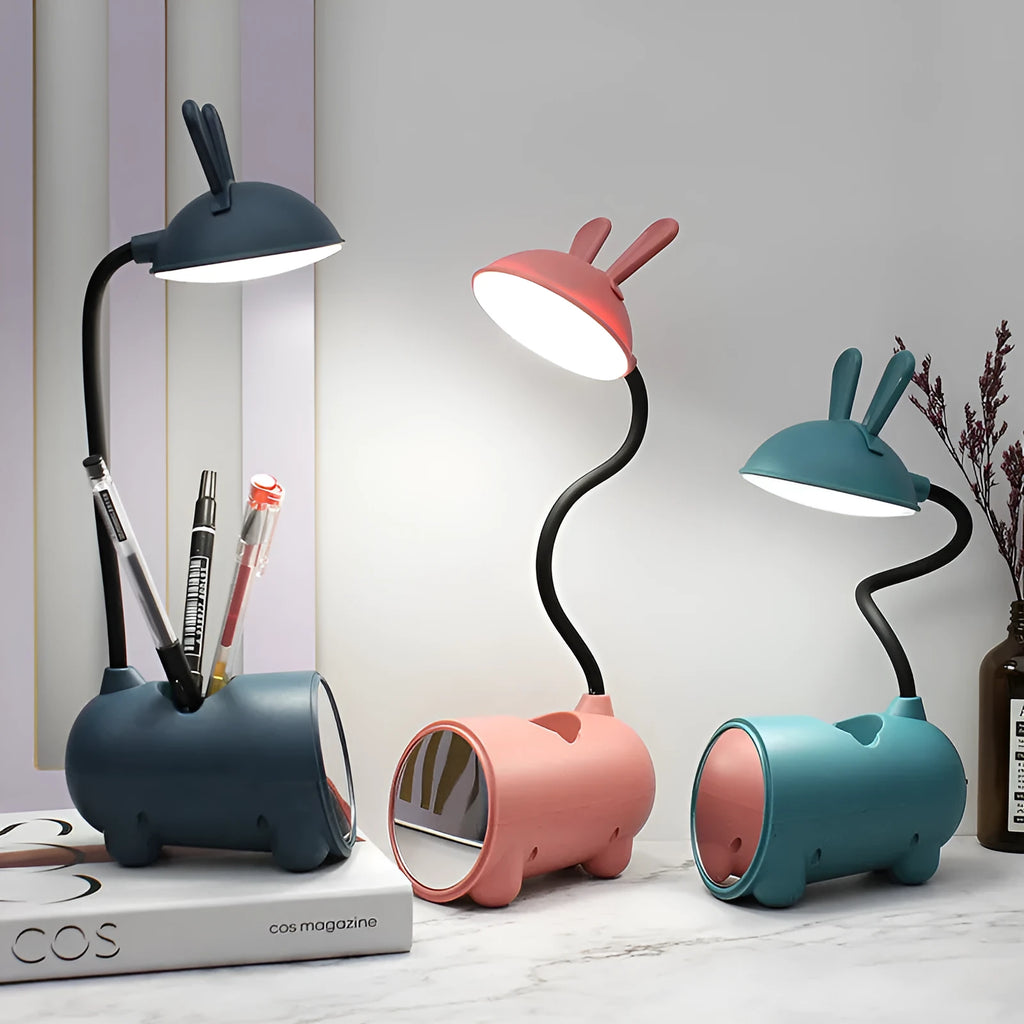 Cartoon-style USB table lamp with pen storage compartment in green colour