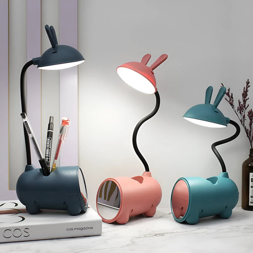 Cartoon-style USB table lamp with pen storage compartment in green colour
