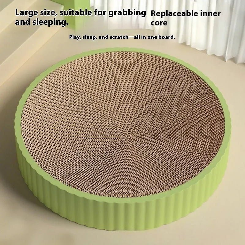 Round green cat scratching board with corrugated cardboard centre measuring 55cm diameter