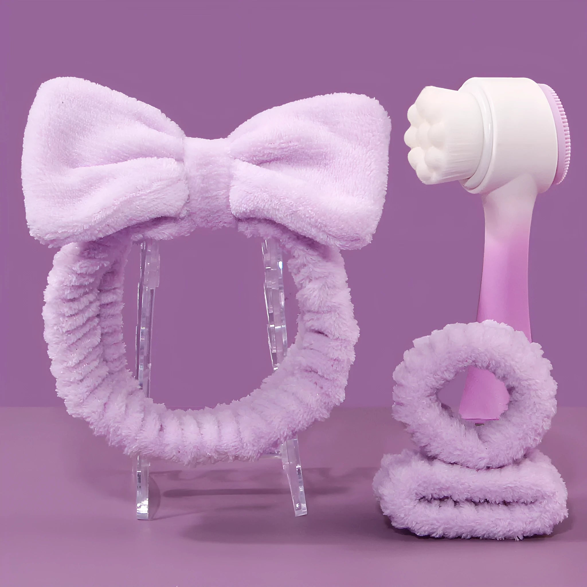 Facial brush set with coral fleece hair band, nylon bristle brush, and plastic toothbrush in purple, grey, white, or pink colours