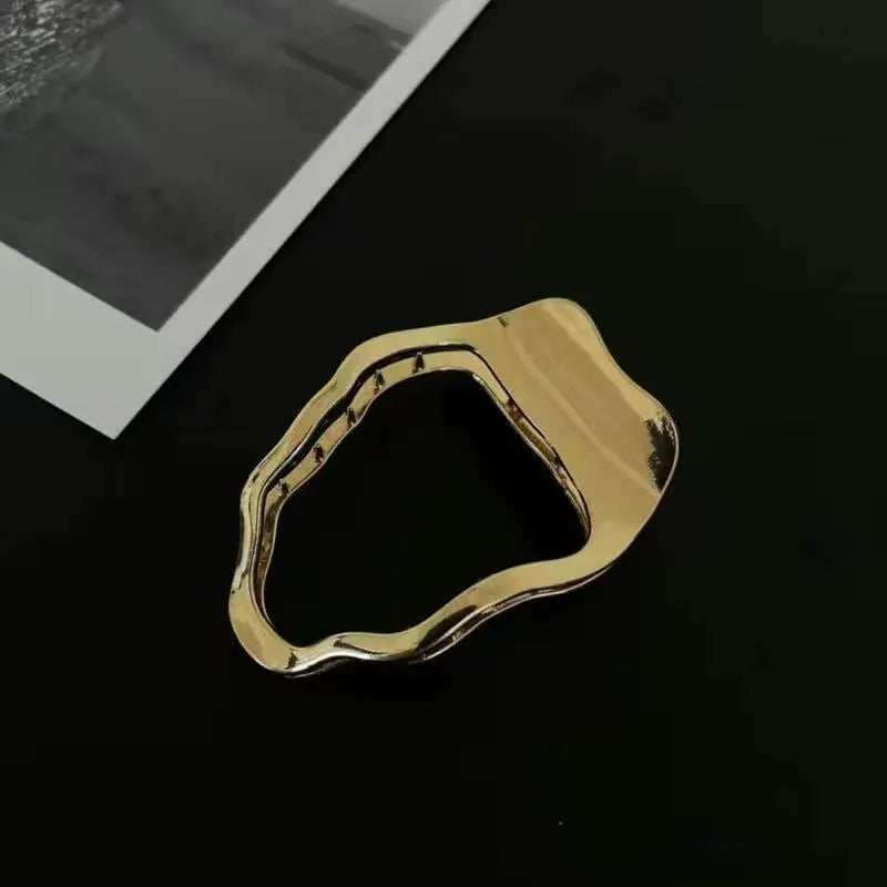 Gold and silver zinc alloy hair barrettes in arc, square, and triangle shapes.