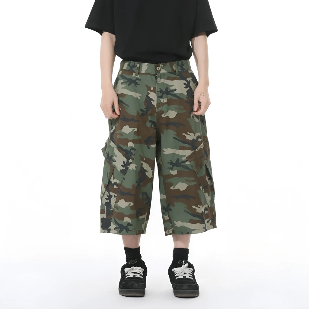 Men's cotton camouflage loose fit jeans with wide leg, cropped length, side stitching, and large pockets.