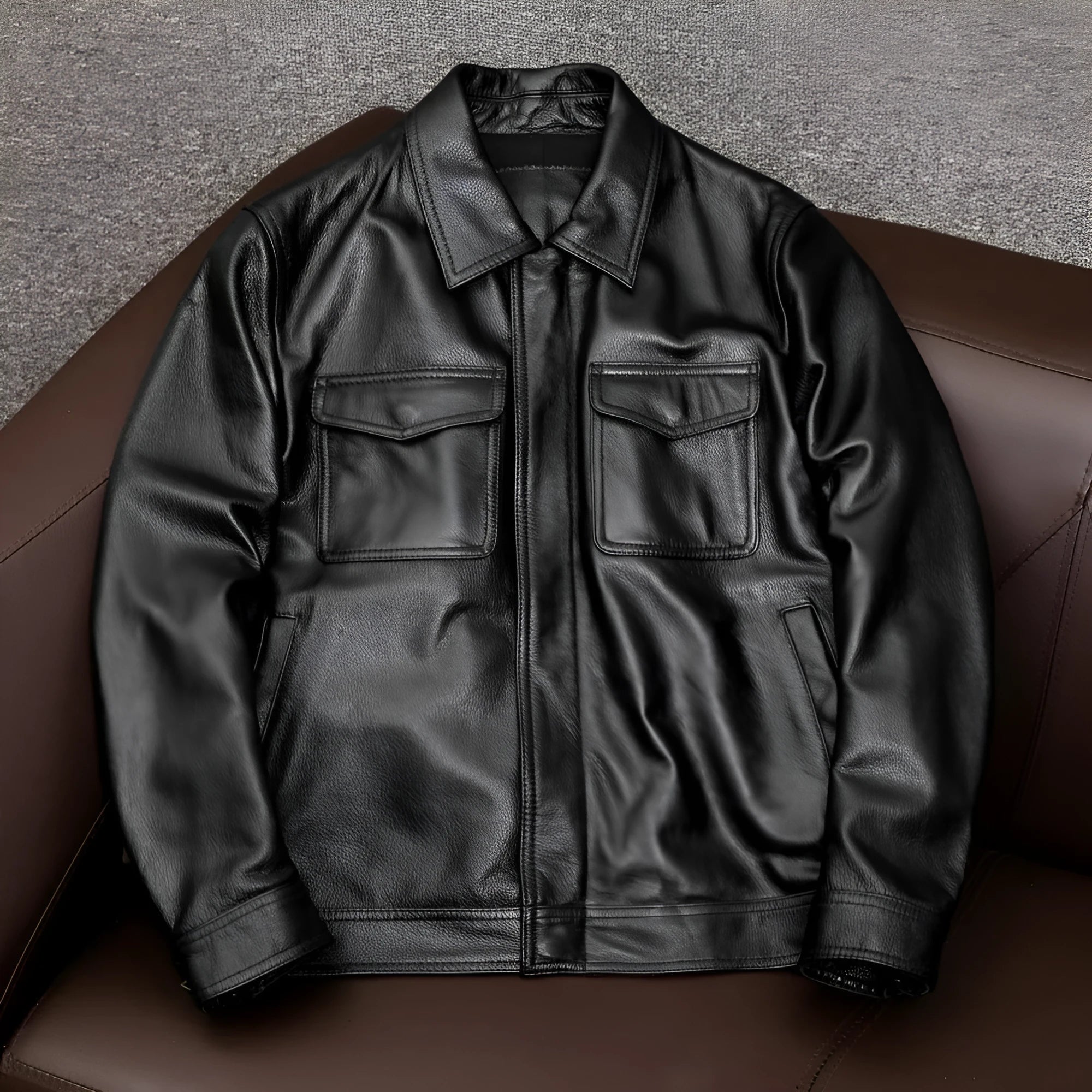 Men's plus size black lapel leather jacket with side pockets, shown on a hanger.