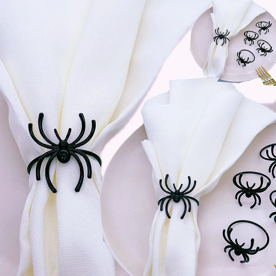 Six black metal spider napkin rings for Halloween table decoration
