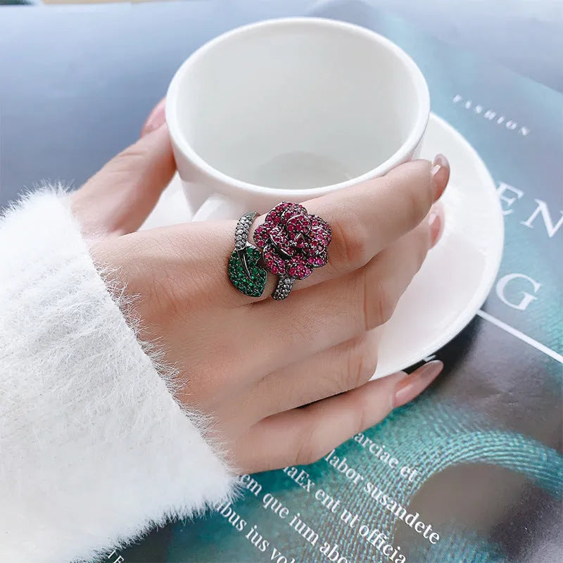 Black gold colour women's ring with geometric flower design and simulation red corundum stone