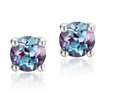 A pair of round, geometric 925 silver ear studs featuring a cultivated Alexandrite Alexander Stone.