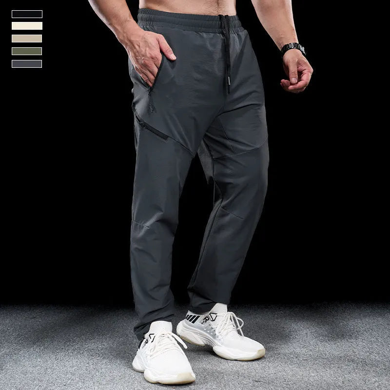Men's black waterproof quick-drying nylon workout trousers for sports and exercise