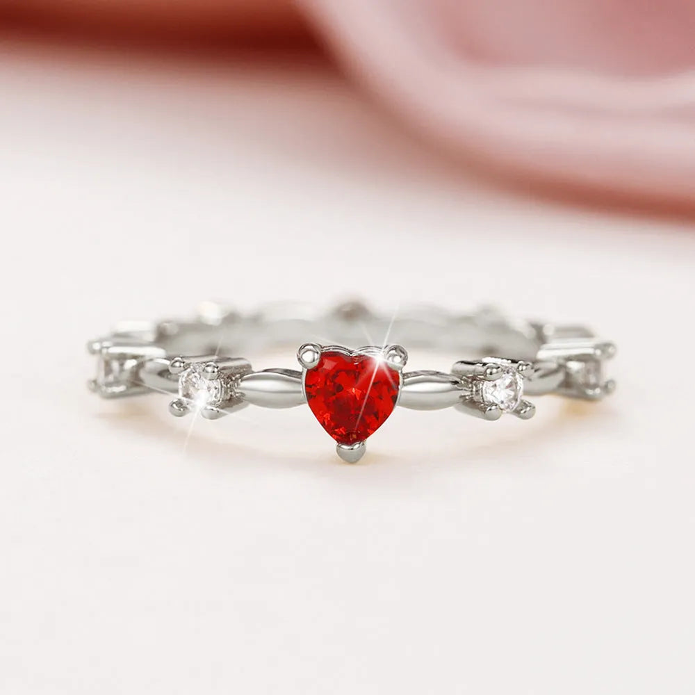 Gold or silver electroplated copper ring with a peach heart shape set with zircon stones.