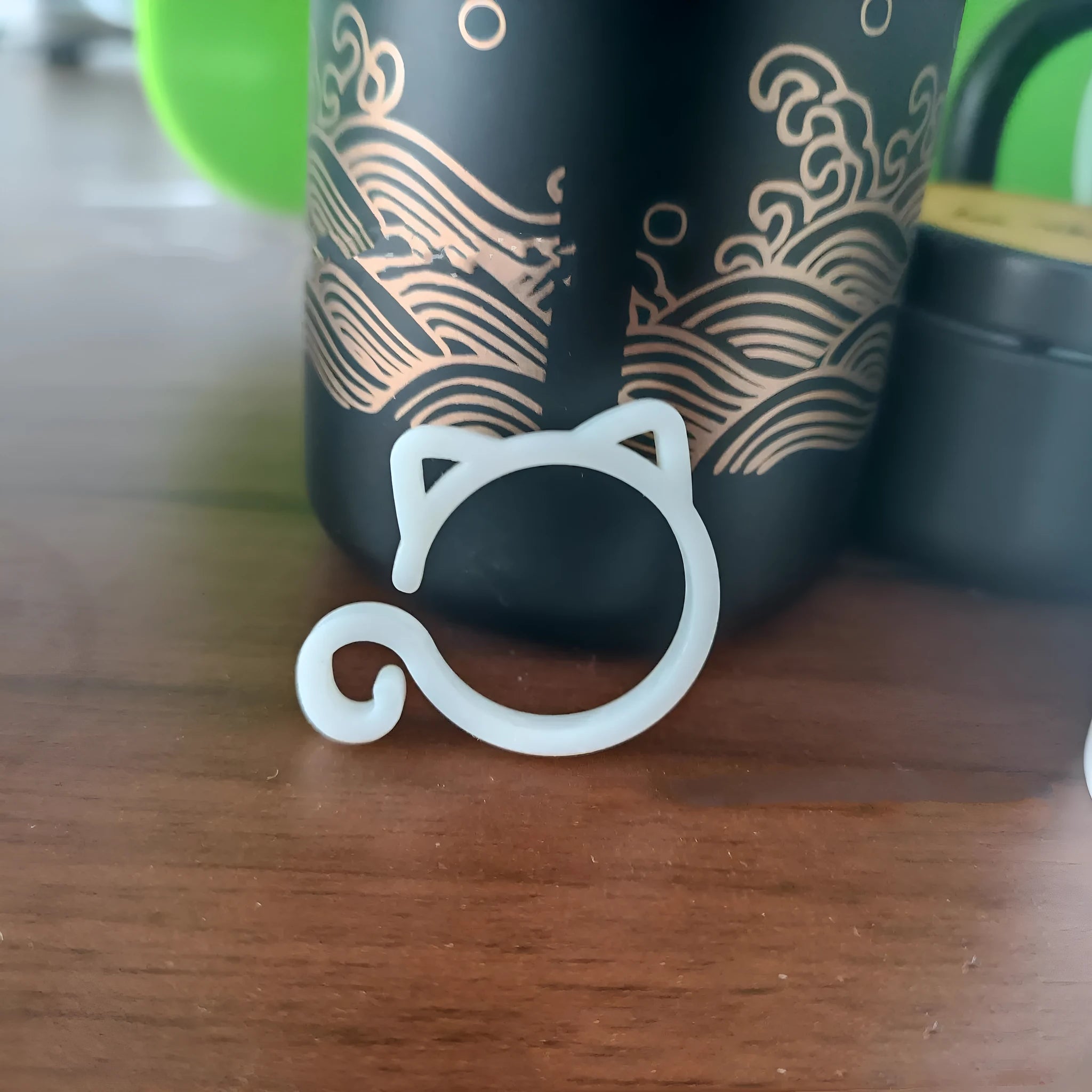 Colourful cat-shaped plastic plant clip for indoor gardening support.