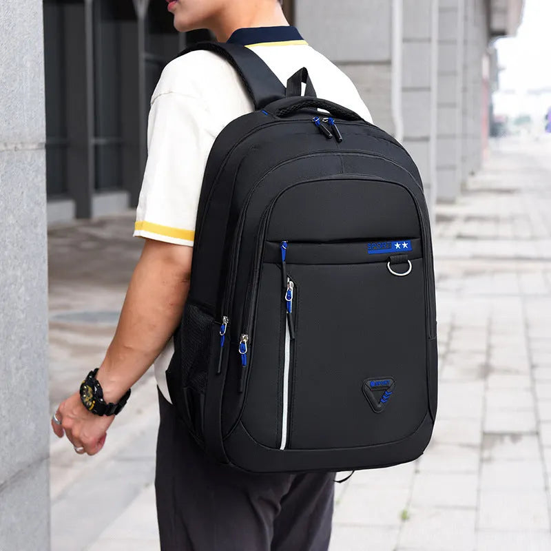 Men's Oxford cloth schoolbag showing air pillow belt system and 20-35 litre capacity