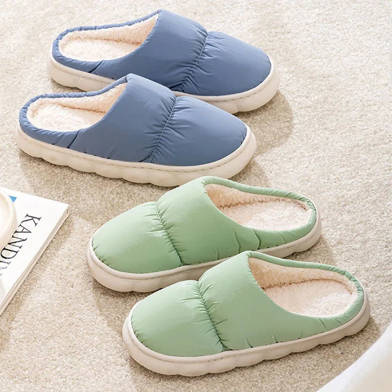 Pair of thick-soled winter slippers with artificial leather upper and plush lining, shown in a choice of colours.