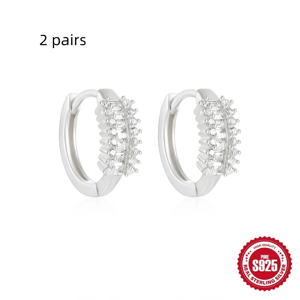 Sterling silver geometric stud earrings with small round diamond accents in gold or silver electroplated finish
