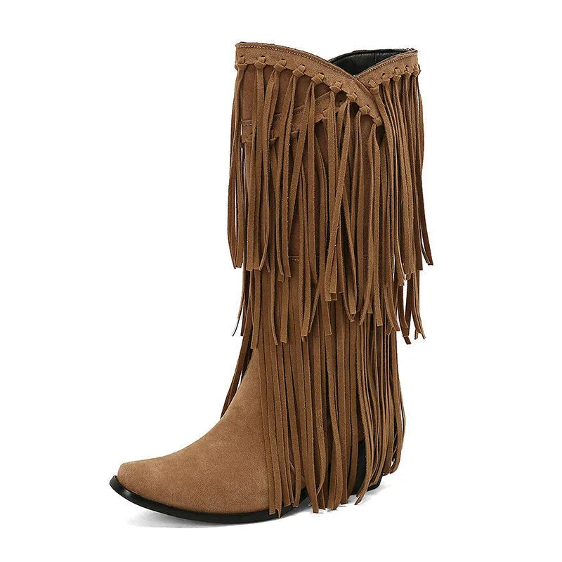 Women's beige suede mid-calf boots with a chunky heel and tassel detail on display.