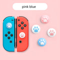 Four silicone protective caps for Nintendo Lite rocker buttons in assorted colours