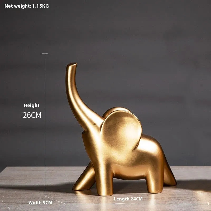 Modern resin elephant ornament in rose gold colour displayed on wooden surface