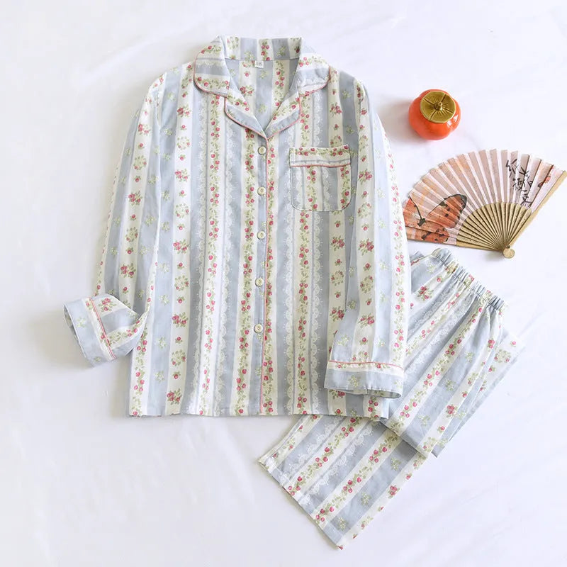 Ladies' red and white striped cotton gauze long-sleeved top and trousers loungewear set laid flat.