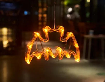 Seven Halloween-themed LED hanging lights with suction cups including spiders, pumpkins and ghosts