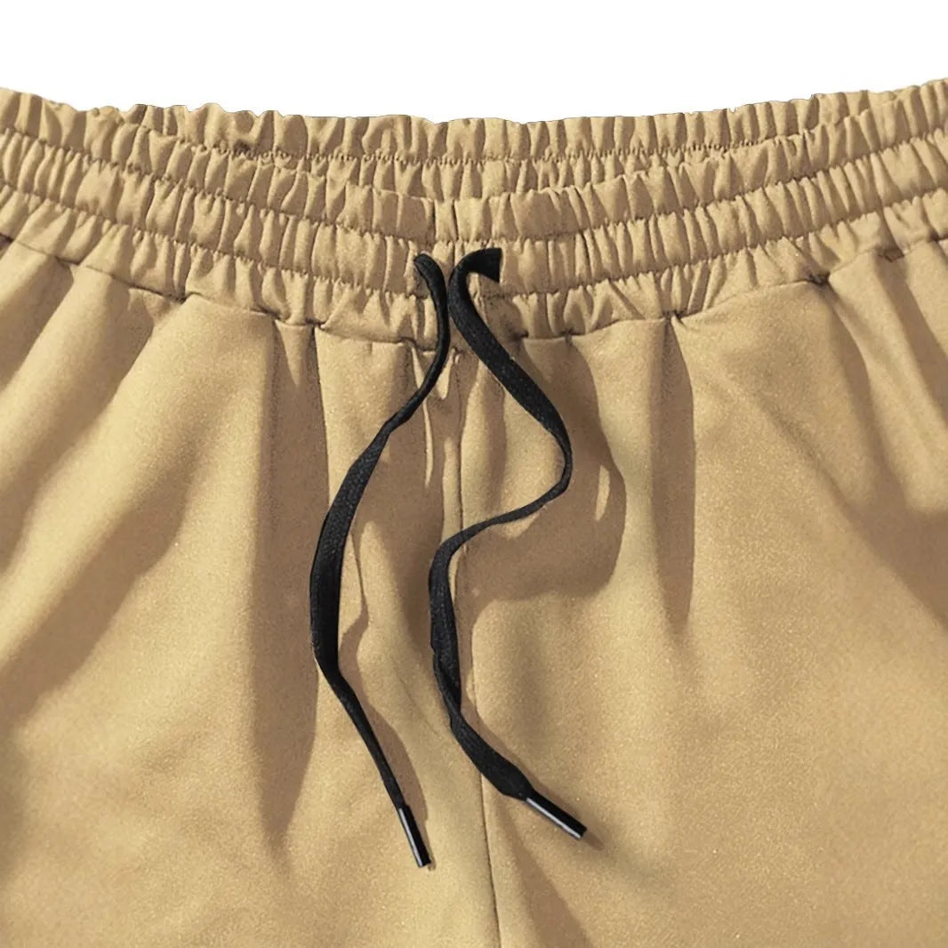 Man wearing khaki coconut print polyester sports shorts