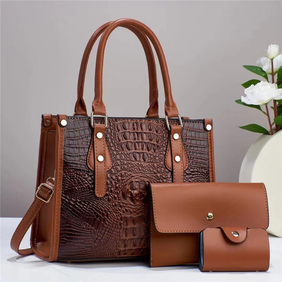 Minimalist textured PU three-piece bag set showing crossbody bag, wallet, and card holder in a contrast colour.