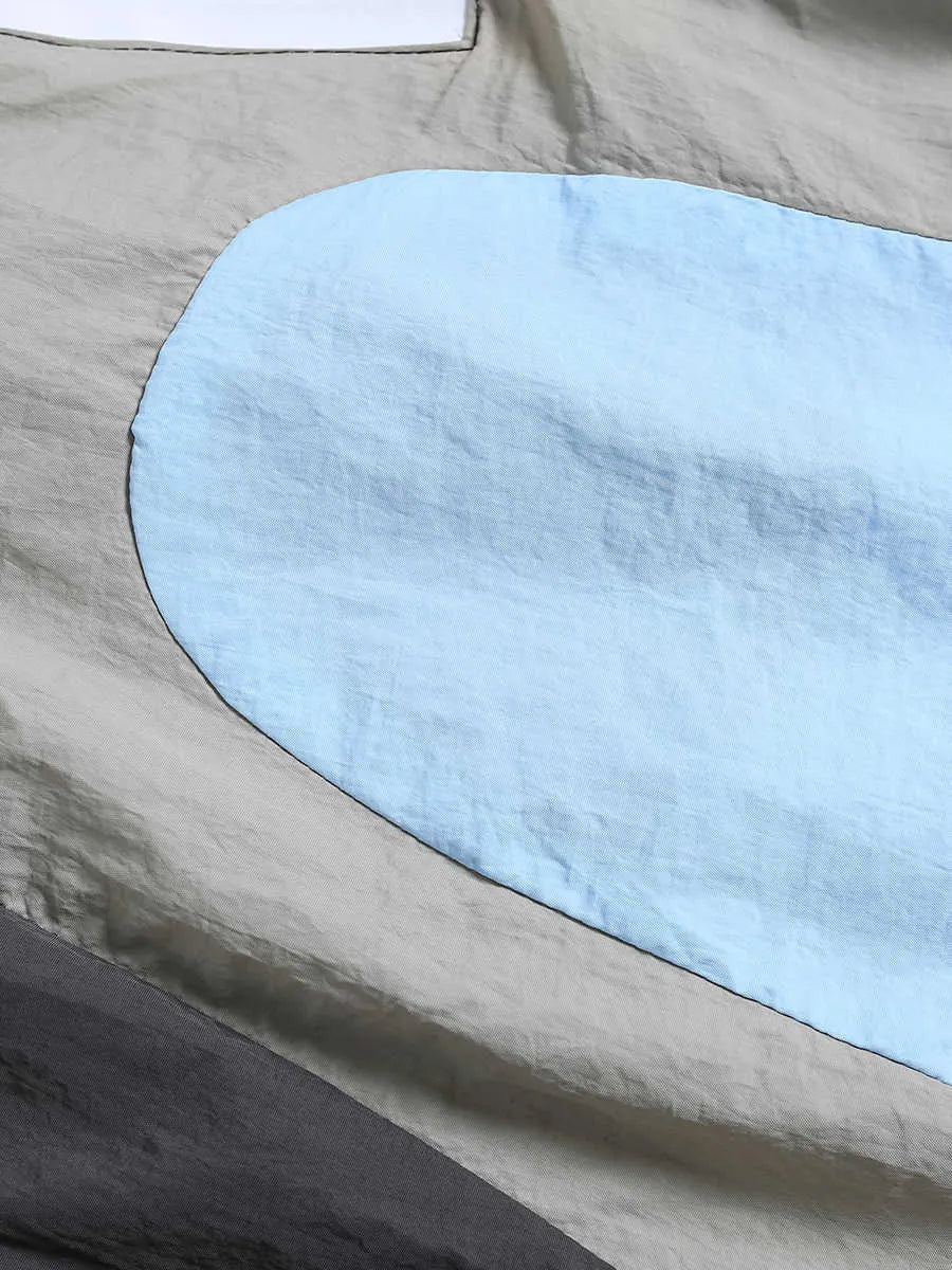 Blue men's loose patchwork quick-drying sports shorts with straight legs and elasticated waist.