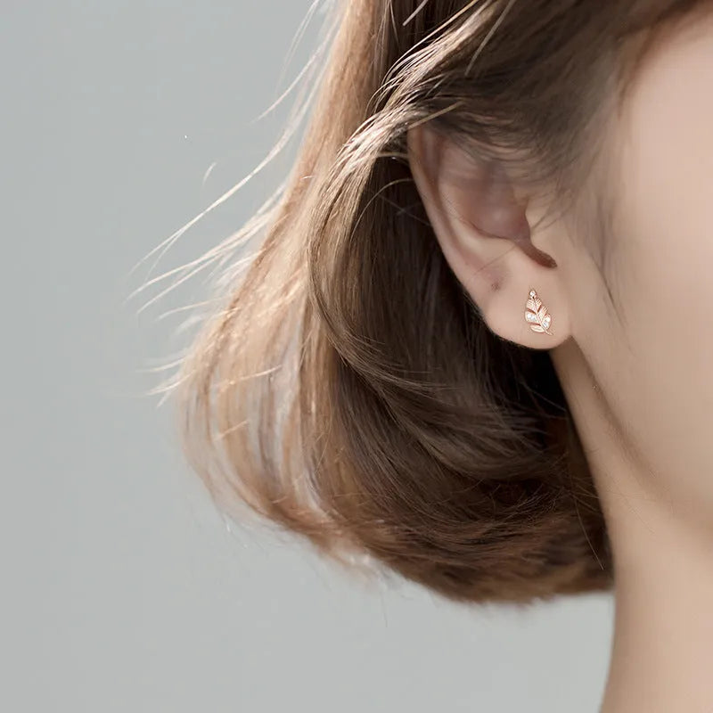 Copper willow leaf stud earrings with micro-inlaid leaf detail and geometric Mori style in rose gold and white gold colour