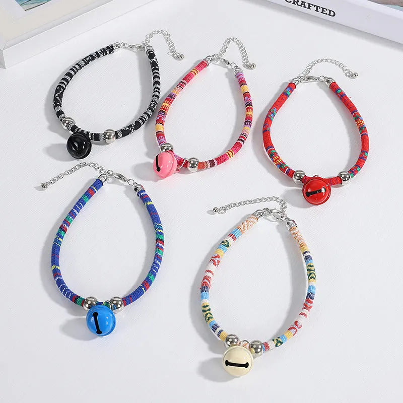 Ethnic patterned adjustable pet collar with a small bell in multiple colour options