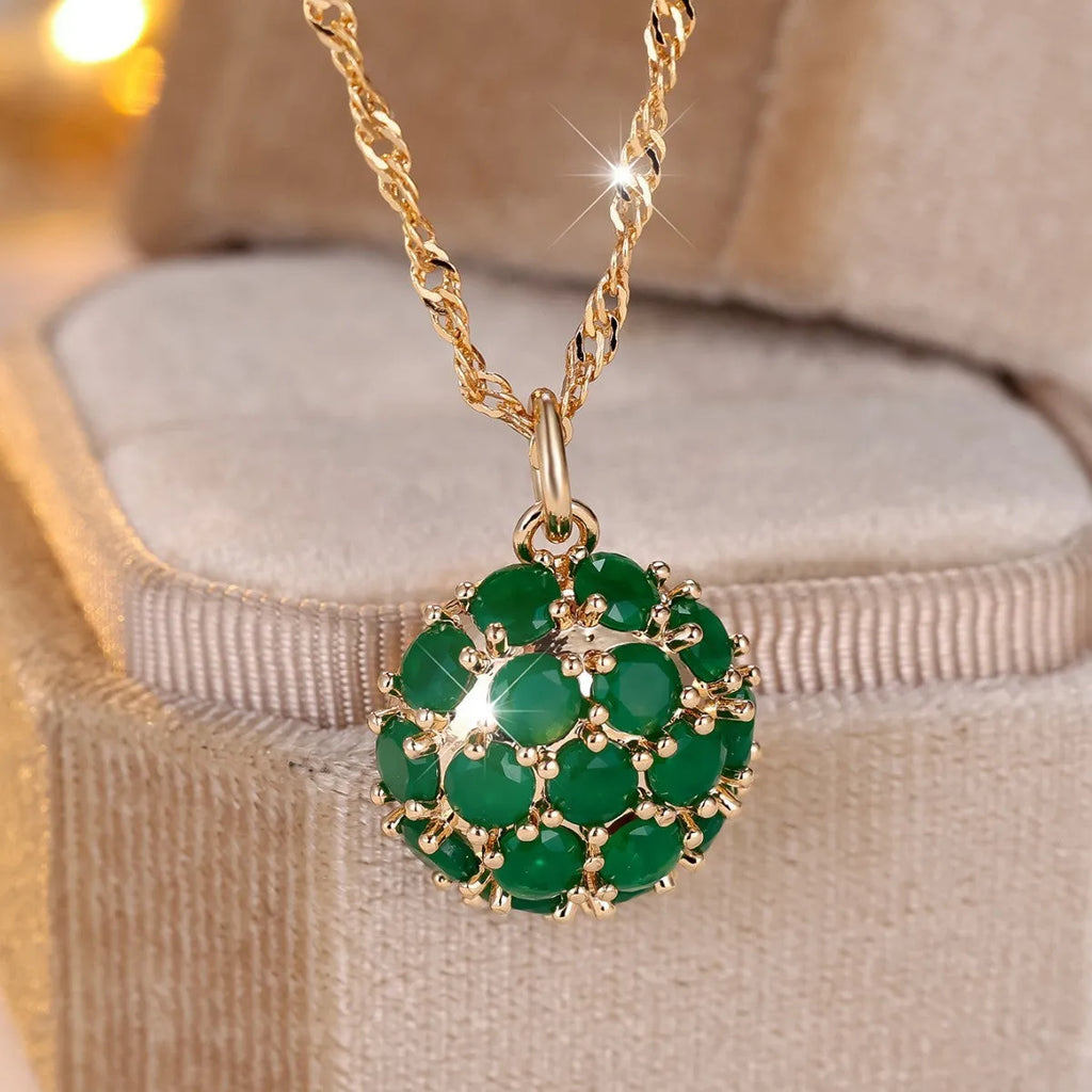 Round emerald diamond necklace with champagne gold electroplated finish on geometric pendant and chain