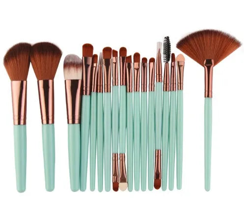 MAANGE 18-piece makeup brush set with fan-shaped cosmetic tools laid out on a table.