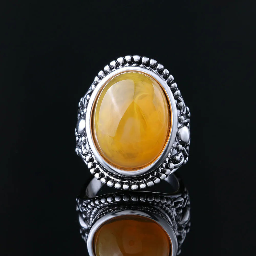 Geometric alloy ring with an antique silver amber electroplated finish.