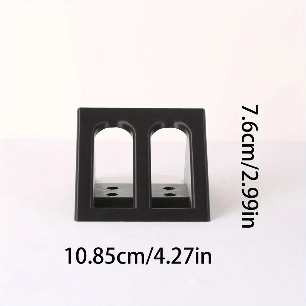 Black plastic pistol display stand with punk-style moulding for 1:1 scale gun models.