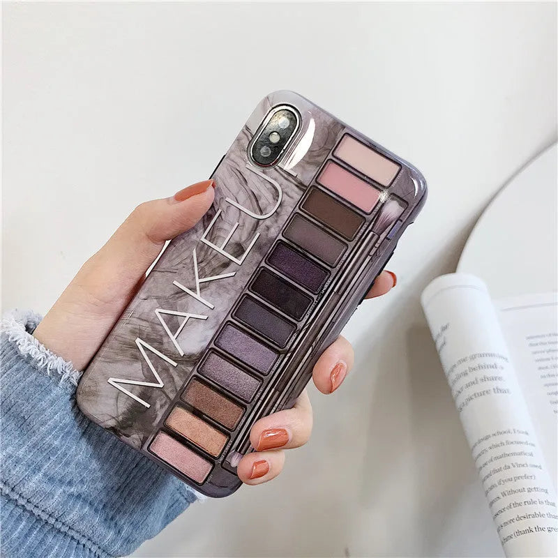 Silicone iPhone case with an eye shadow pattern design in flesh and grey colour options.