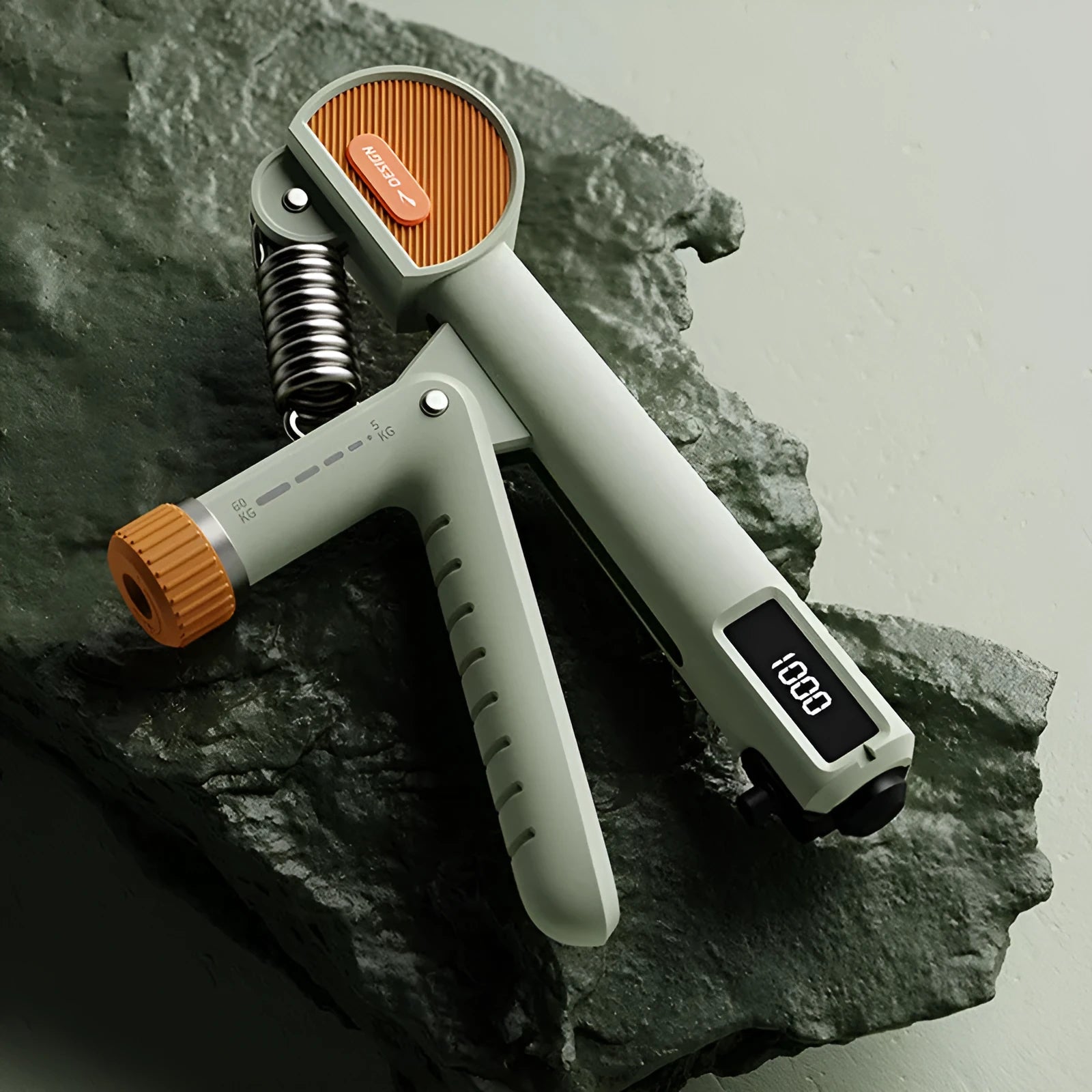 Adjustable spring hand grip exerciser in ABS plastic, shown in multiple colour options on a neutral background.
