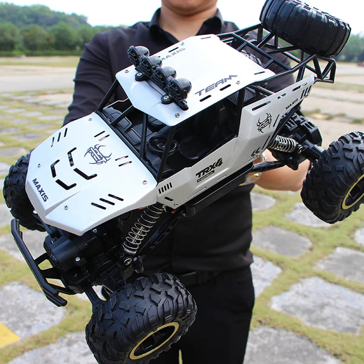 Black and silver 4WD remote control off-road climbing car with 2.4G wireless controller