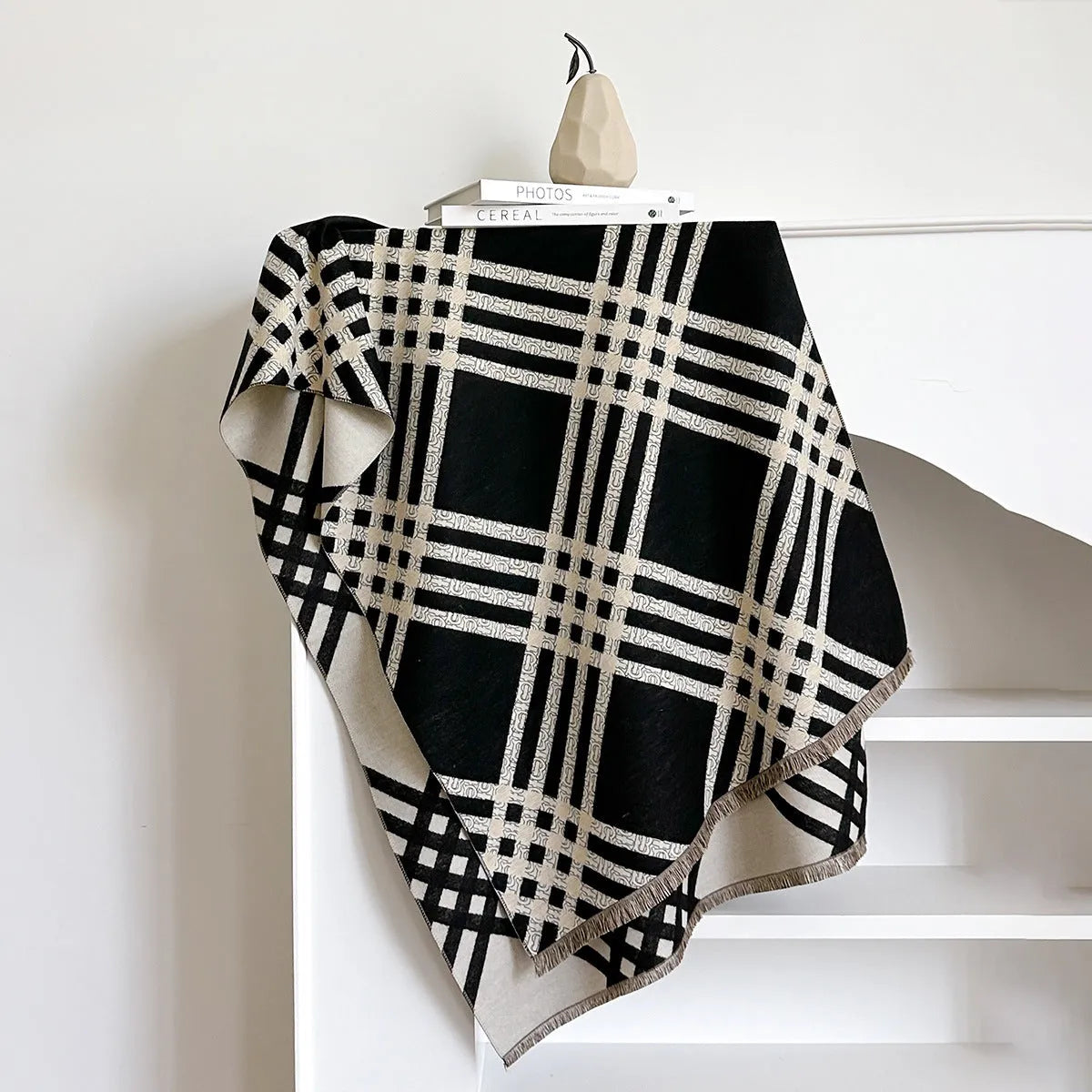 Cashmere-like scarf with tassel detailing in brown colour showing mid-length design