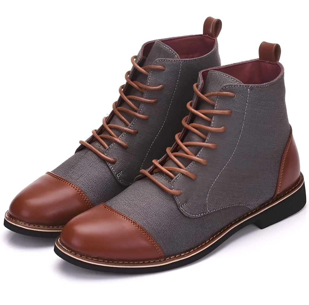 Men's black leather motorcycle boots with metal belt buckle details on a rubber sole.