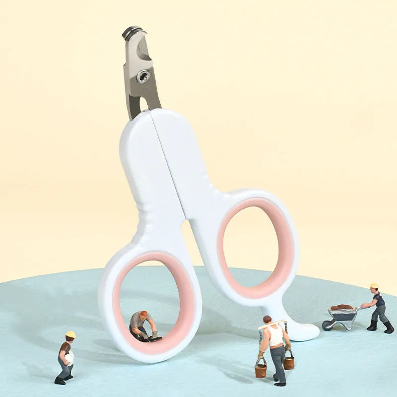 Professional pet nail clippers with curved safety tips and a grey non-slip rubber handle.