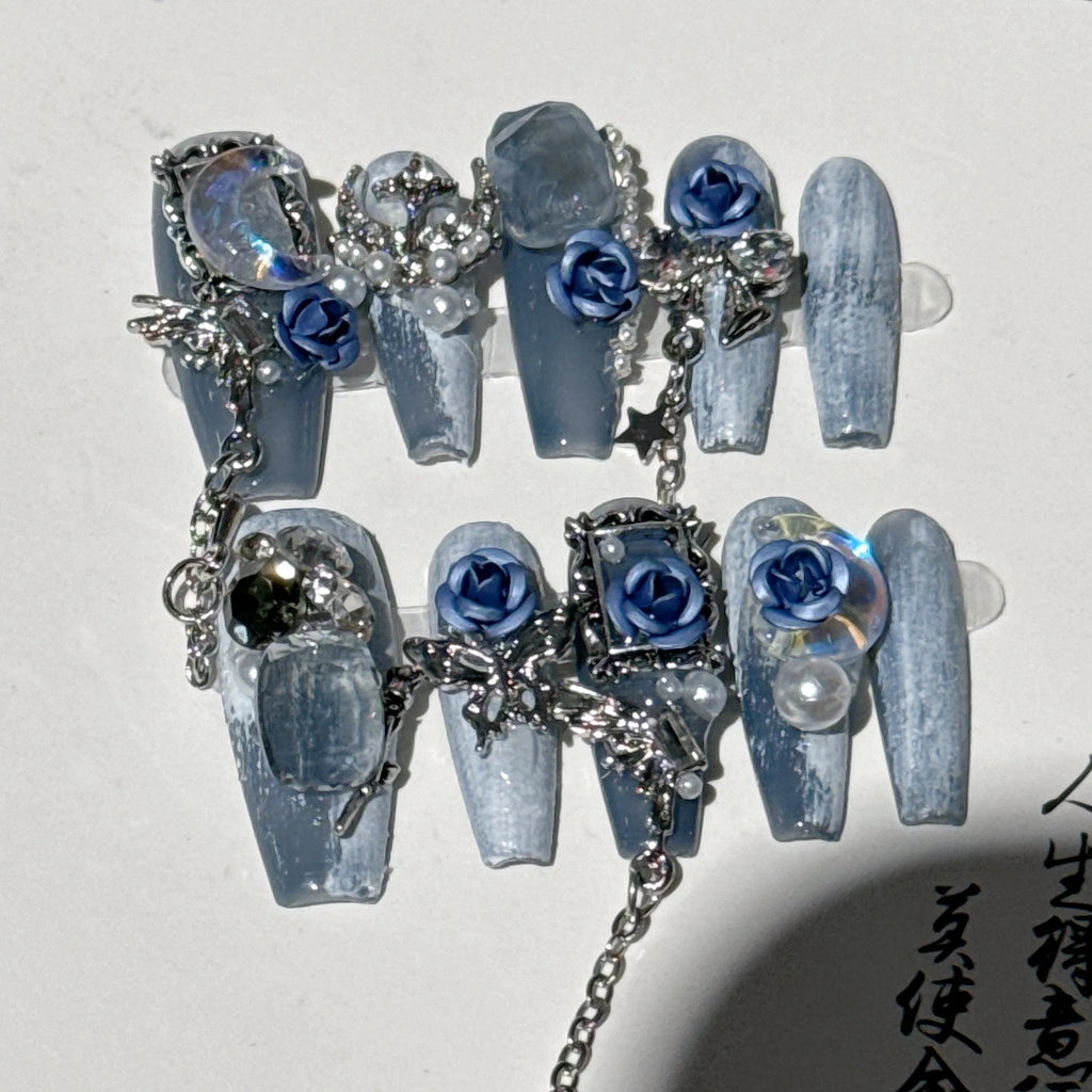 Heavy industry night blue manicure set with ornate rose design and plastic storage case.